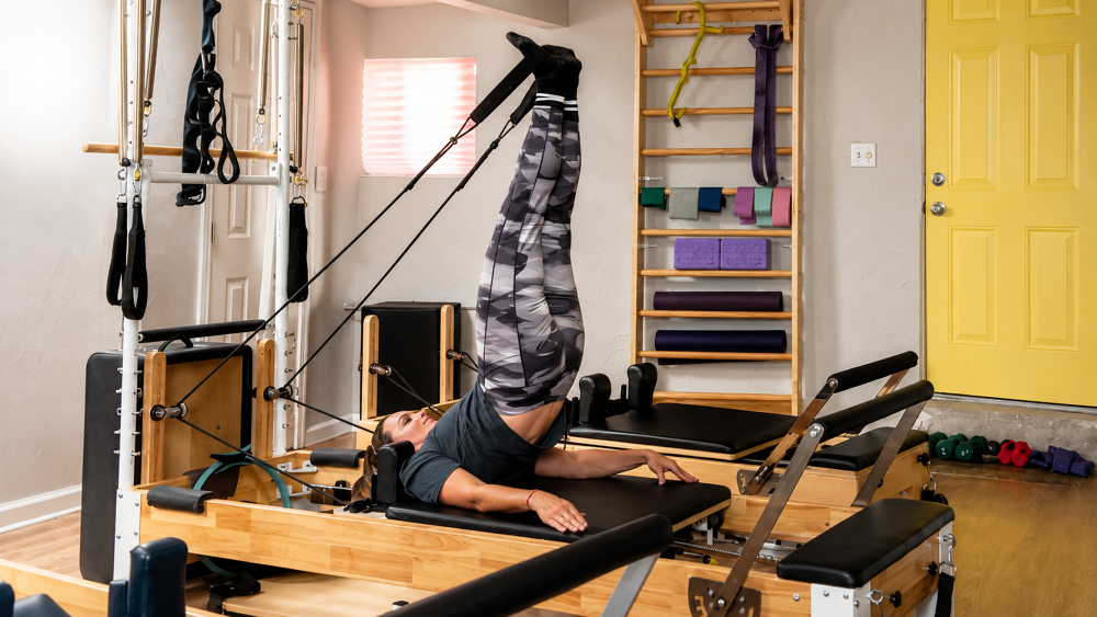 Inside the private MAS Movement Pilates studio in Montrose, California with reformers and Pilates equipment